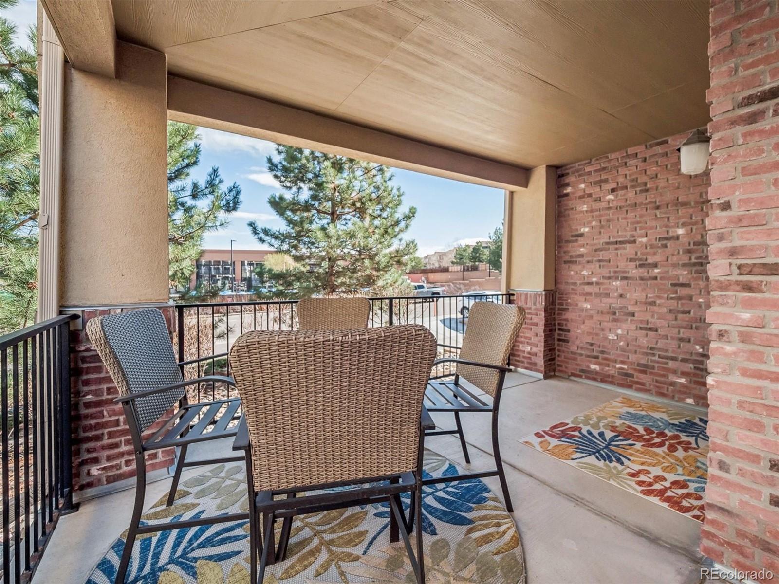 1144 Rockhurst Drive, Unit 107 Highlands Ranch, CO 80129 - Photo 20 of 29 a view of a chairs and table in the balcony