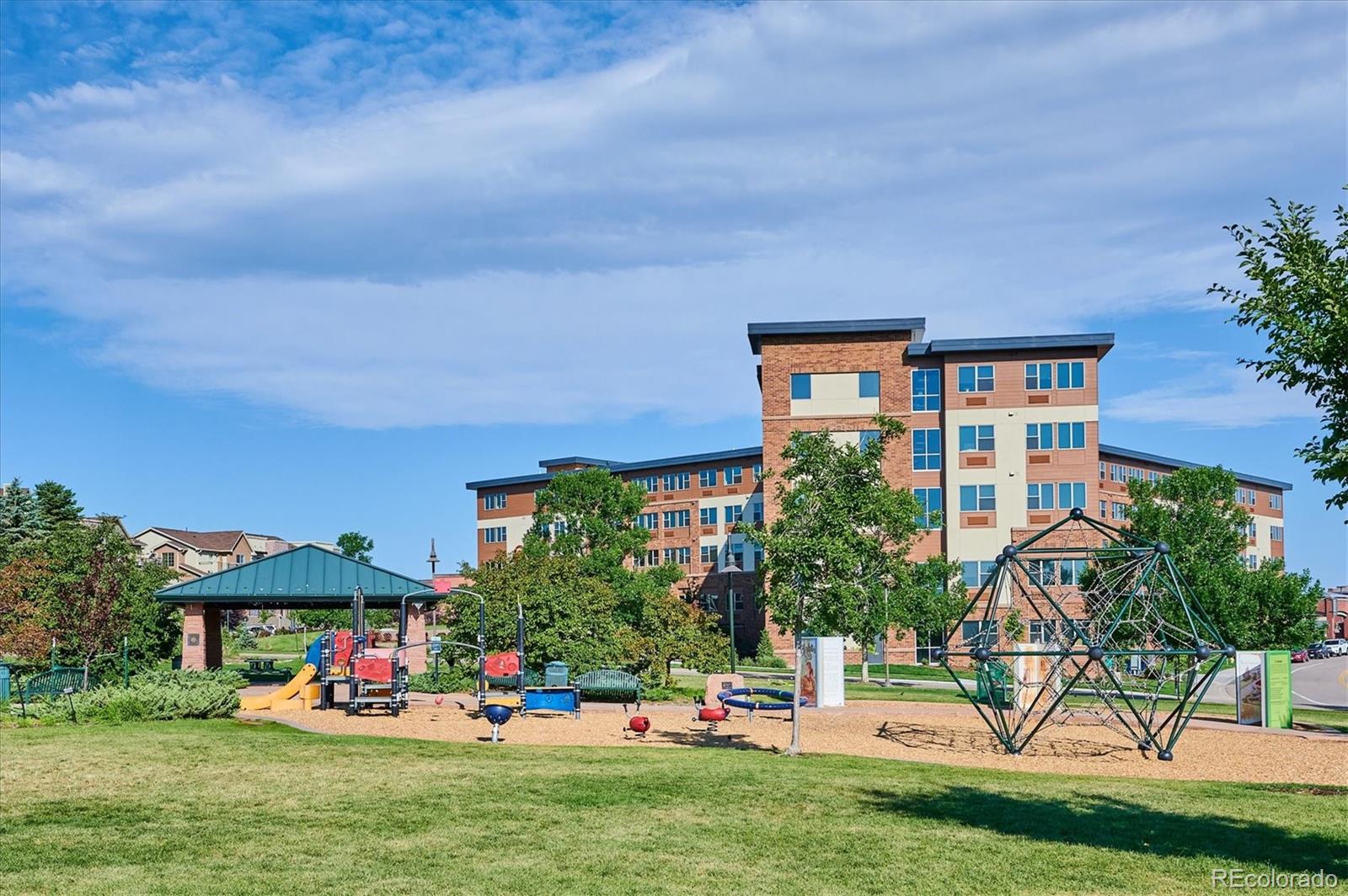 1144 Rockhurst Drive, Unit 107 Highlands Ranch, CO 80129 - Photo 25 of 29 a front view of house with yard