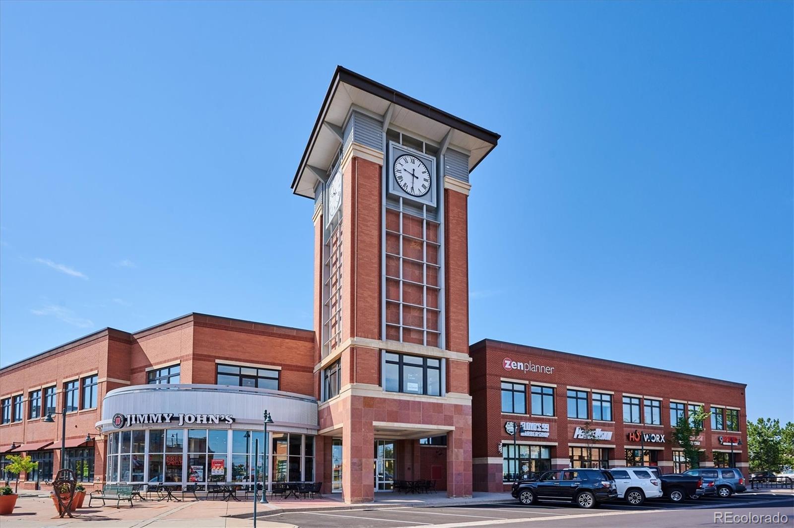 1144 Rockhurst Drive, Unit 107 Highlands Ranch, CO 80129 - Photo 27 of 29 a front view of a building with street view