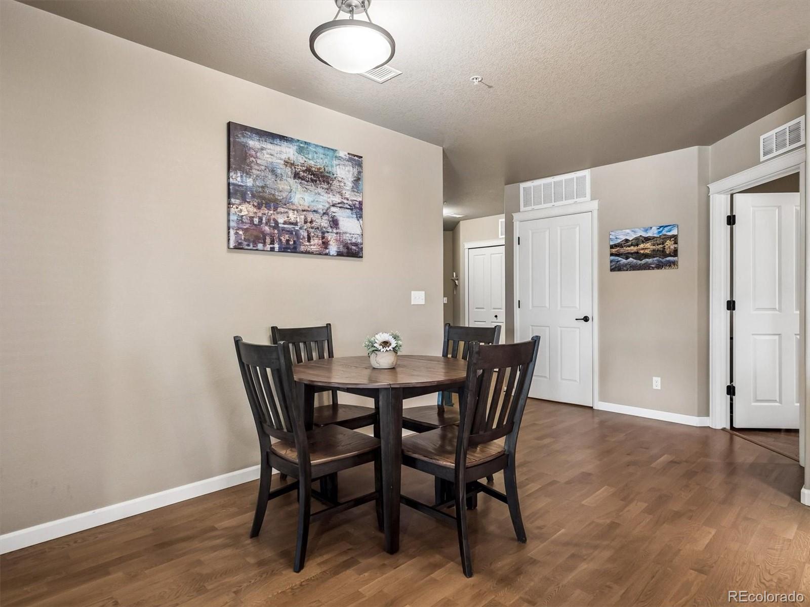 1144 Rockhurst Drive, Unit 107 Highlands Ranch, CO 80129 - Photo 10 of 29 a view of a dining room with furniture