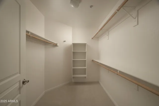 a view of an empty walk in closet