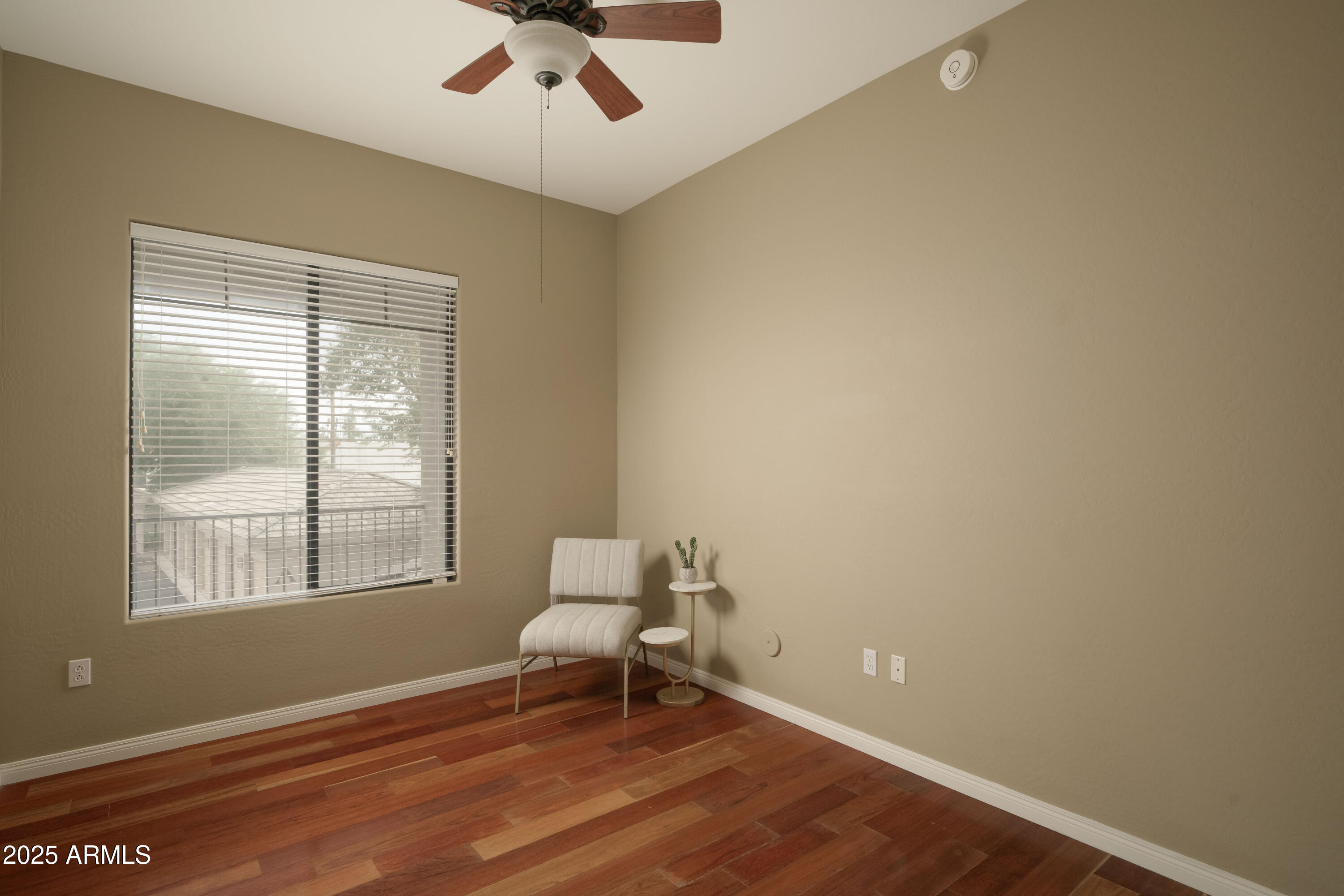 2989 North 44th Street, Unit 2007 Phoenix, AZ 85018 - Photo 18 of 29 a bench sitting in a room next to a window