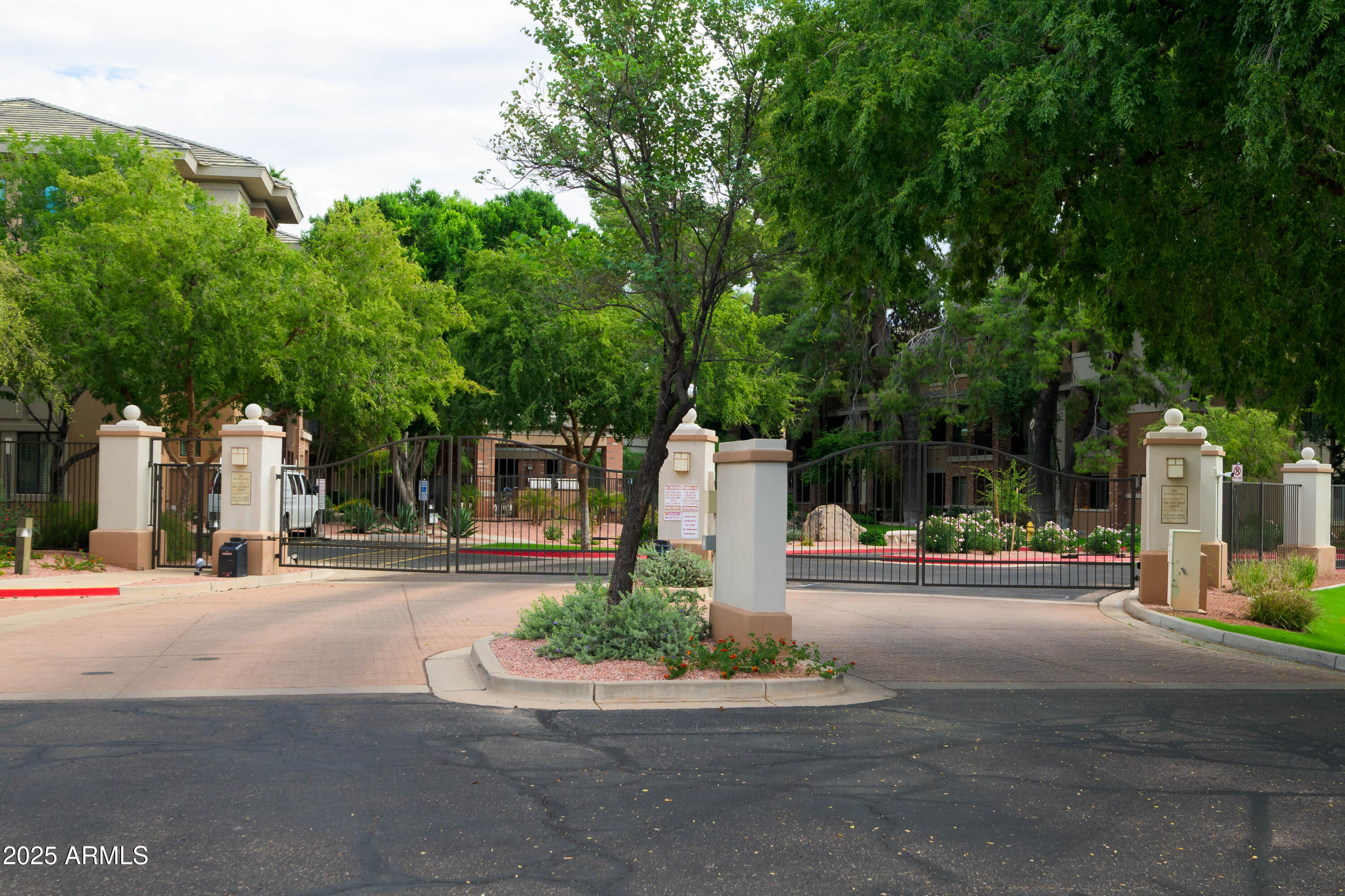 2989 North 44th Street, Unit 2007 Phoenix, AZ 85018 - Photo 21 of 29 front view of a house with a small yard