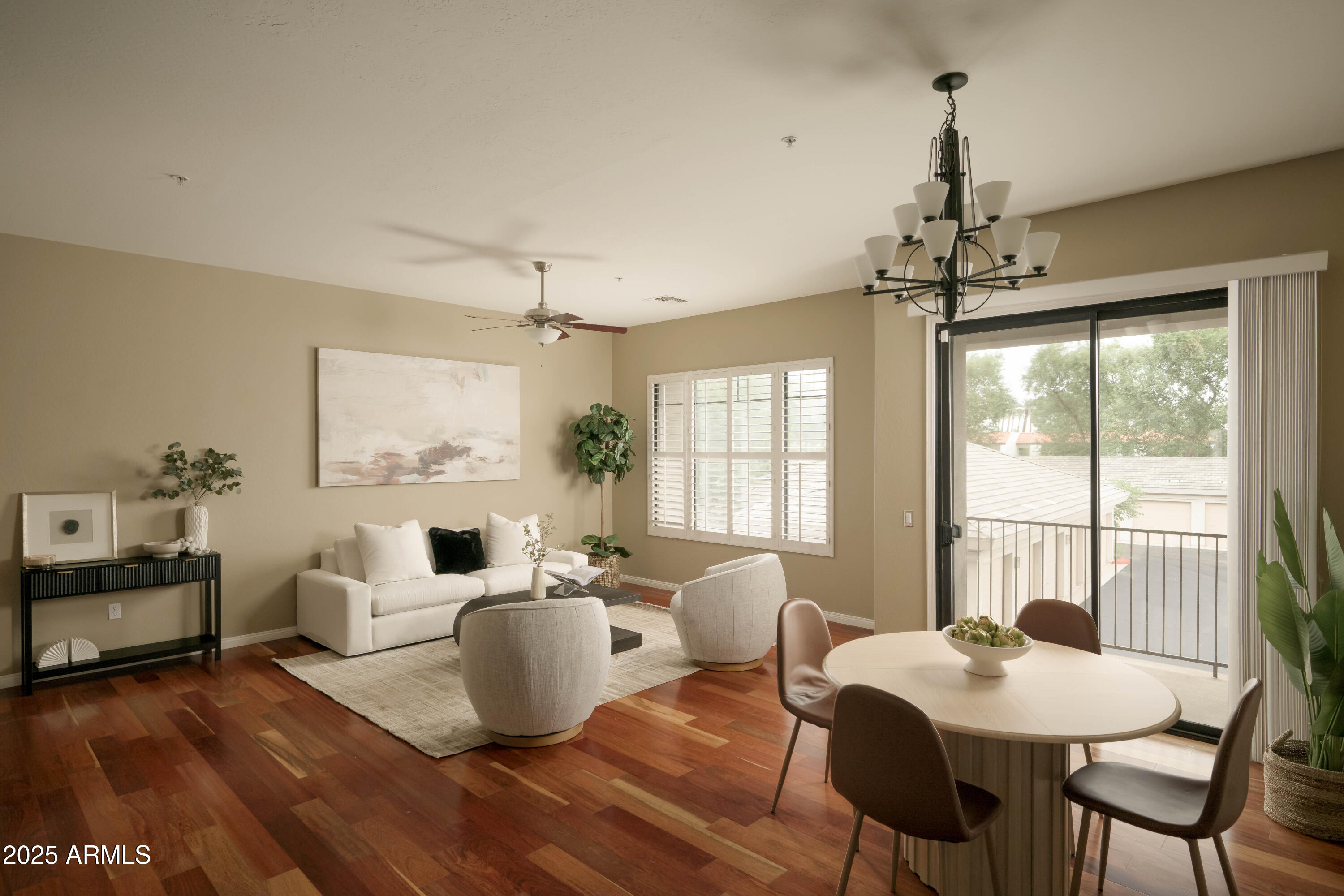 2989 North 44th Street, Unit 2007 Phoenix, AZ 85018 - Photo 4 of 29 a living room with furniture and a chandelier