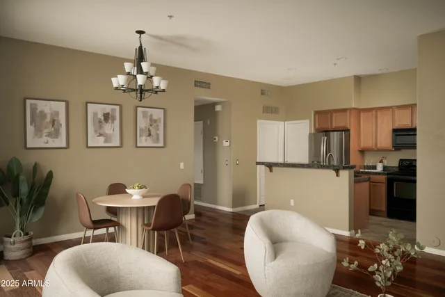 a view of a dining room with furniture and wooden floor