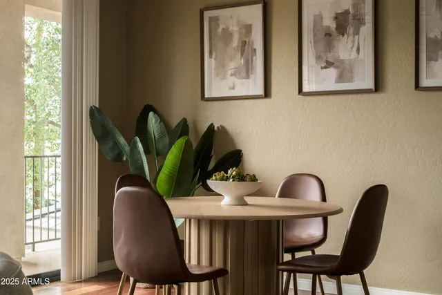 a view of a dining room with furniture and window