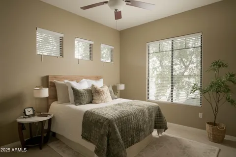 a bedroom with bed and a window