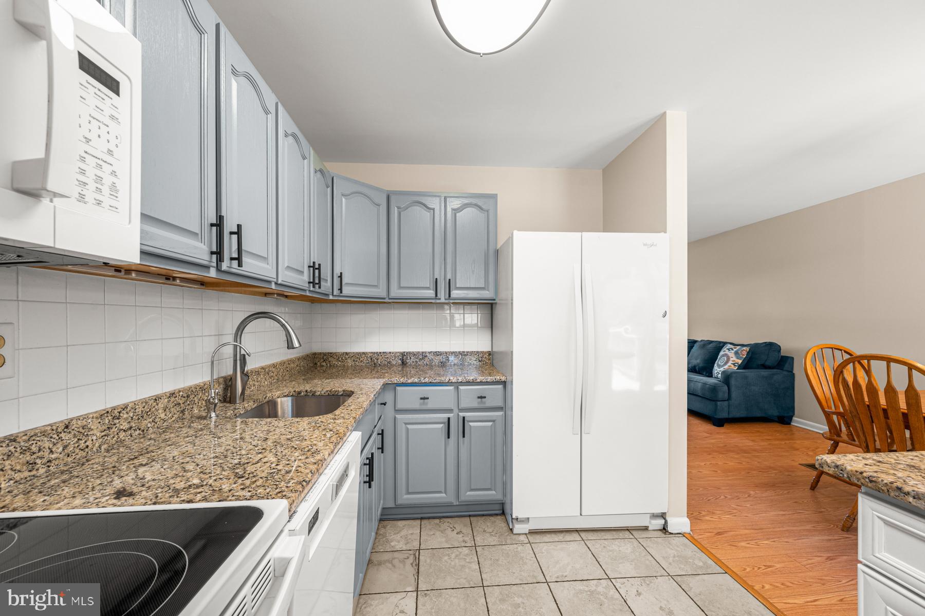 4285 Wolf Hill Drive Hampstead, MD 21074 - Photo 12 of 49 a kitchen with stainless steel appliances granite countertop a sink dishwasher stove top oven and refrigerator