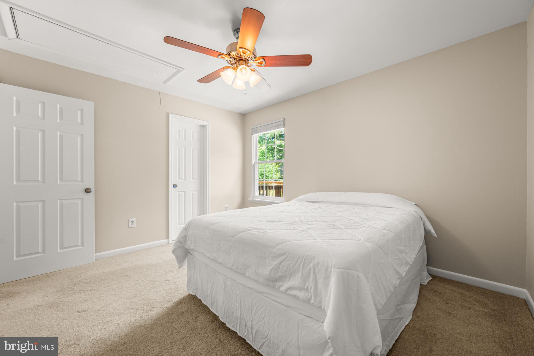 4285 Wolf Hill Drive Hampstead, MD 21074 - Photo 14 of 49 a spacious bedroom with a bed and a ceiling fan