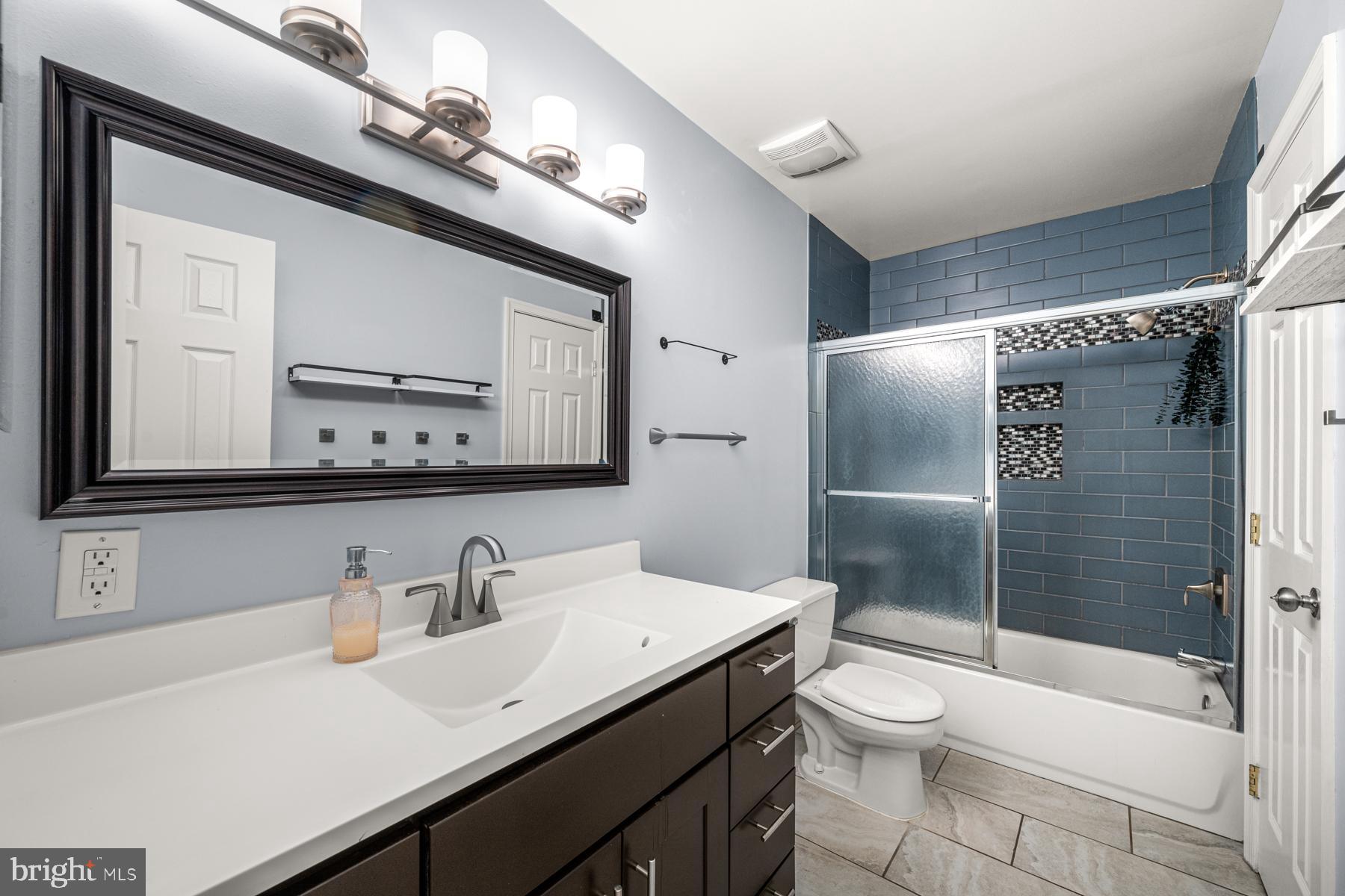 4285 Wolf Hill Drive Hampstead, MD 21074 - Photo 15 of 49 a bathroom with a sink a toilet and shower