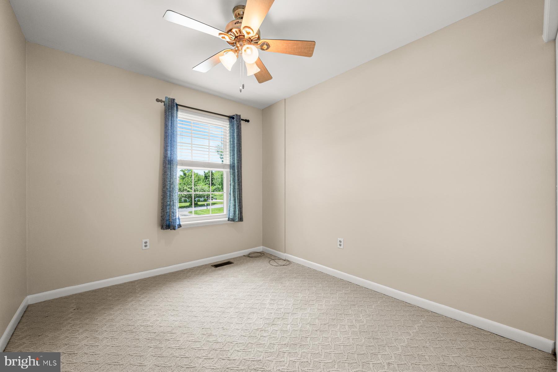 4285 Wolf Hill Drive Hampstead, MD 21074 - Photo 18 of 49 an empty room with a window and a fan