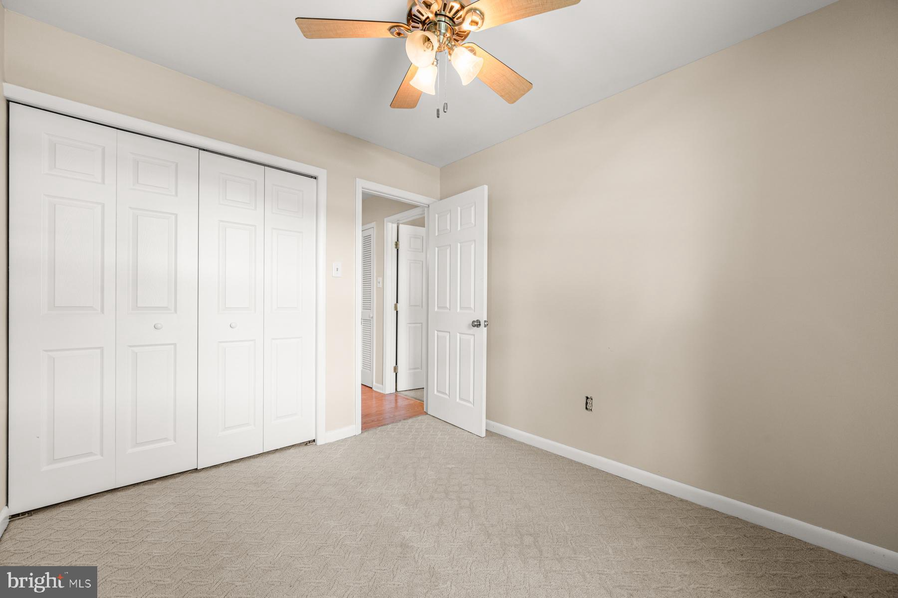 4285 Wolf Hill Drive Hampstead, MD 21074 - Photo 19 of 49 a view of an empty room and chandelier fan