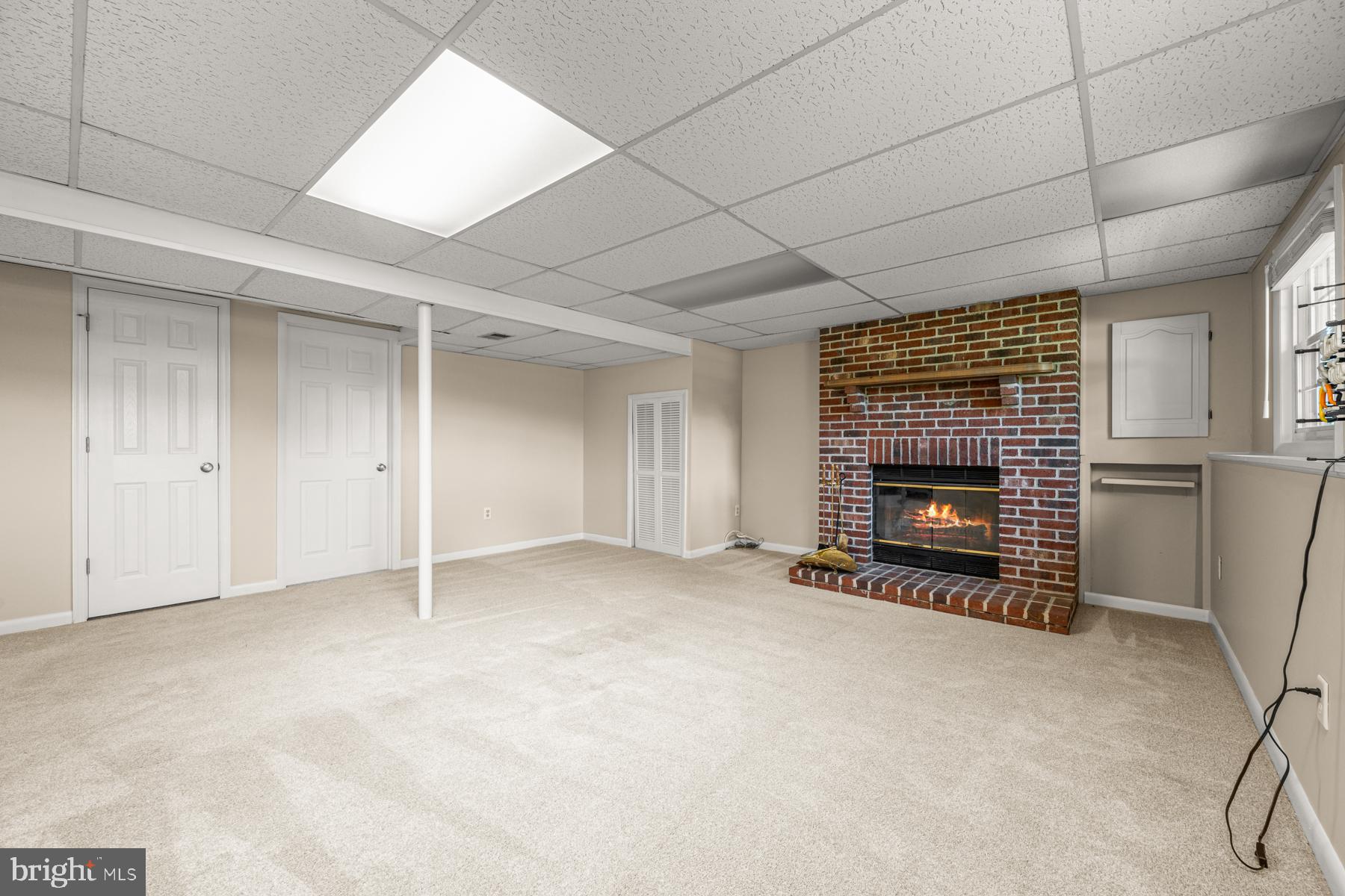 4285 Wolf Hill Drive Hampstead, MD 21074 - Photo 22 of 49 an empty room with a fireplace and window