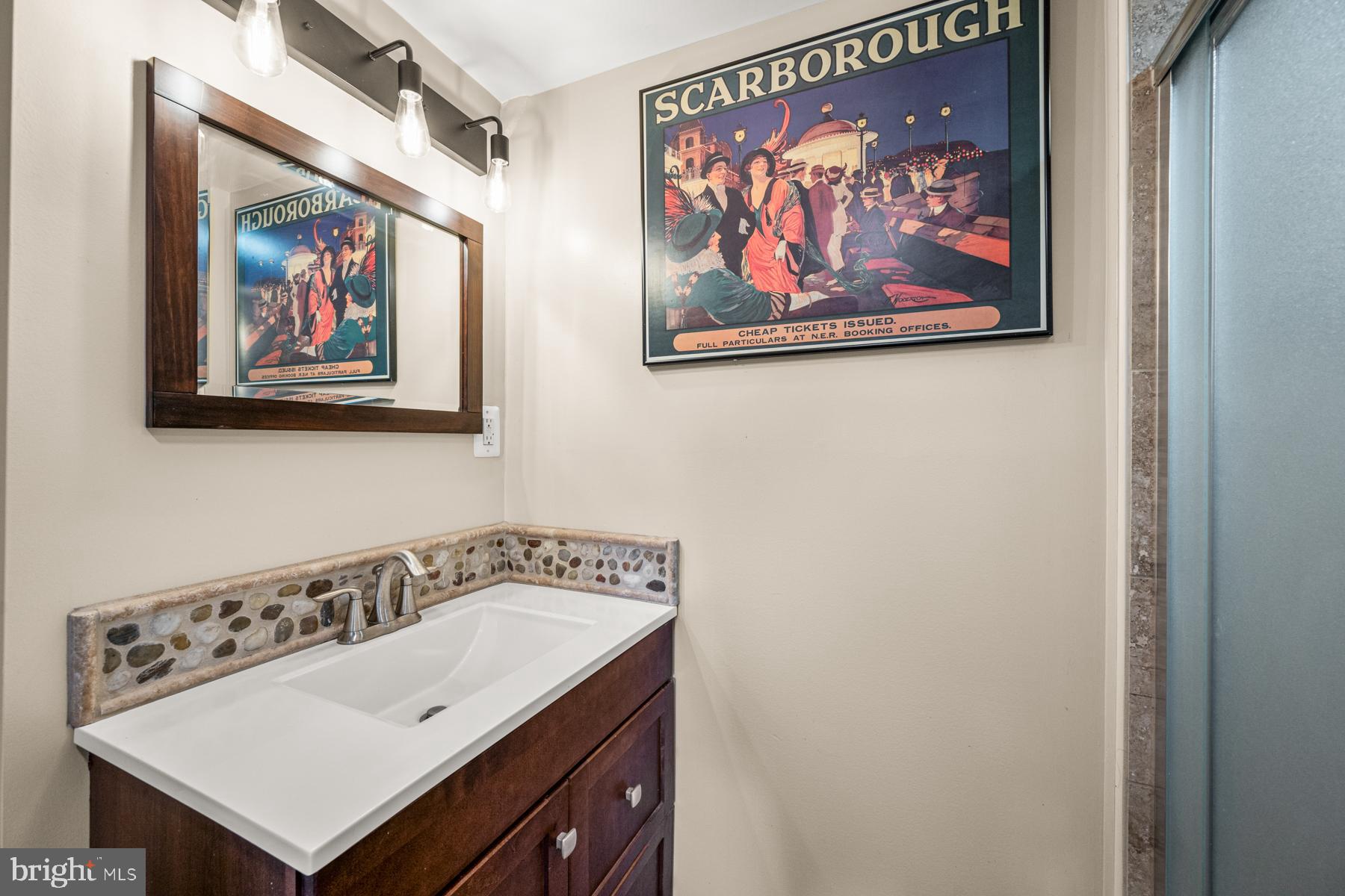 4285 Wolf Hill Drive Hampstead, MD 21074 - Photo 28 of 49 a bathroom with a painting on the wall and a shower