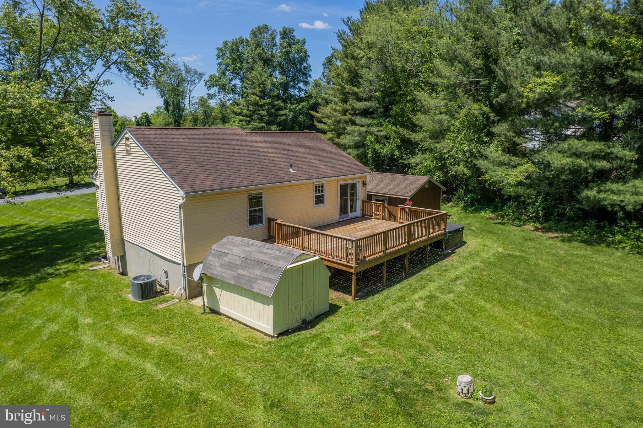 4285 Wolf Hill Drive Hampstead, MD 21074 - Photo 31 of 49 a aerial view of a house with a yard table and chairs