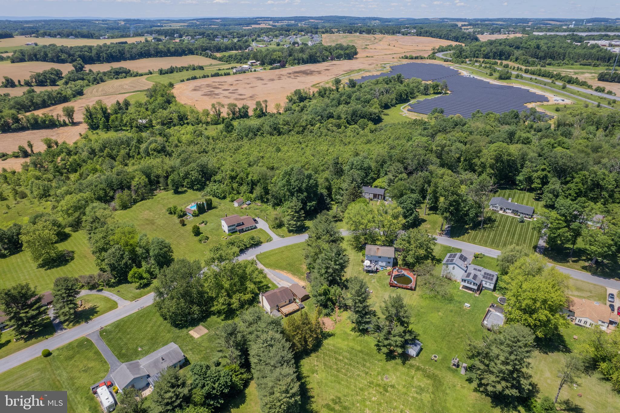 4285 Wolf Hill Drive Hampstead, MD 21074 - Photo 45 of 49 an aerial view of a houses with a lake view