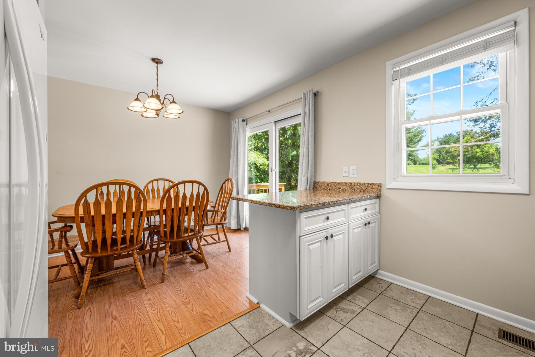 4285 Wolf Hill Drive Hampstead, MD 21074 - Photo 7 of 49 a very nice looking dining room with a window and chandelier