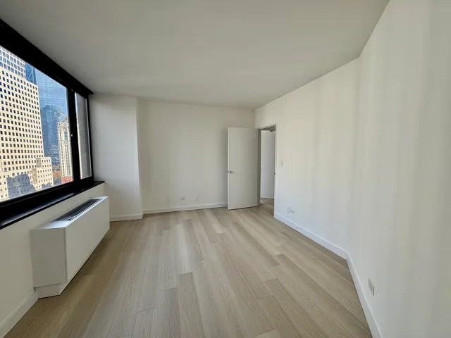 a kitchen with stainless steel appliances granite countertop a stove and a microwave