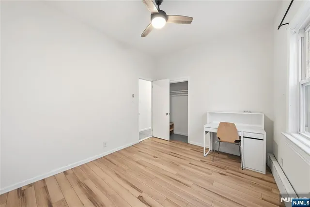 a bedroom with a bed and a chair