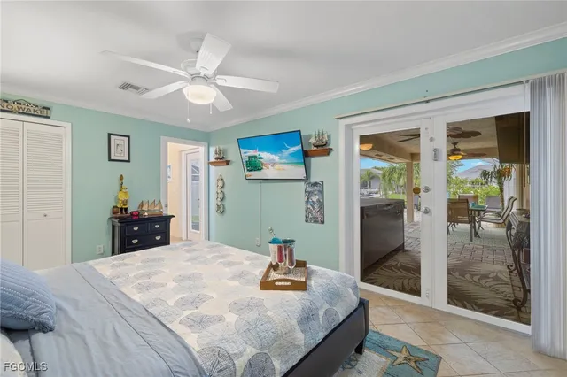 a bedroom with a bed and a large mirror