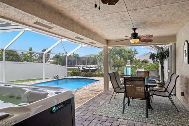 a view of a dining room with furniture wooden floor and chandelier