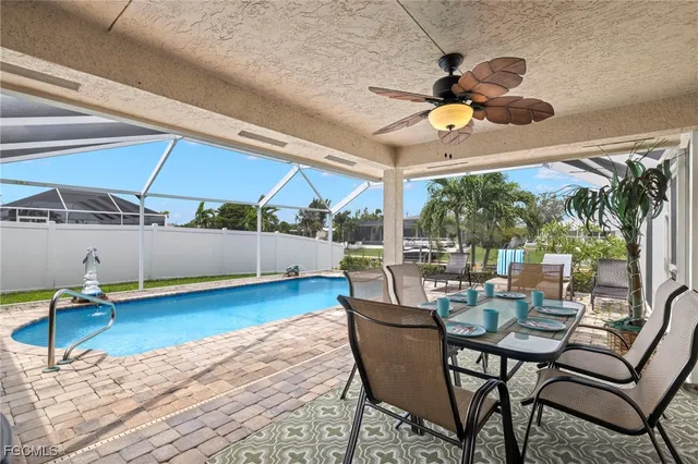 a view of a dining room with furniture wooden floor and chandelier