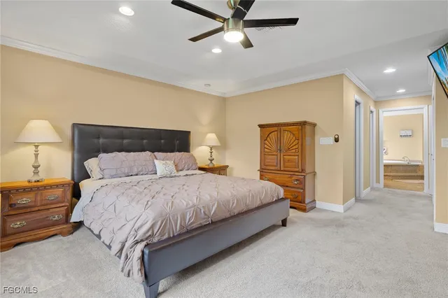a spacious bedroom with a bed and cabinet