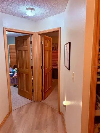 a view of front door with a chair and a window