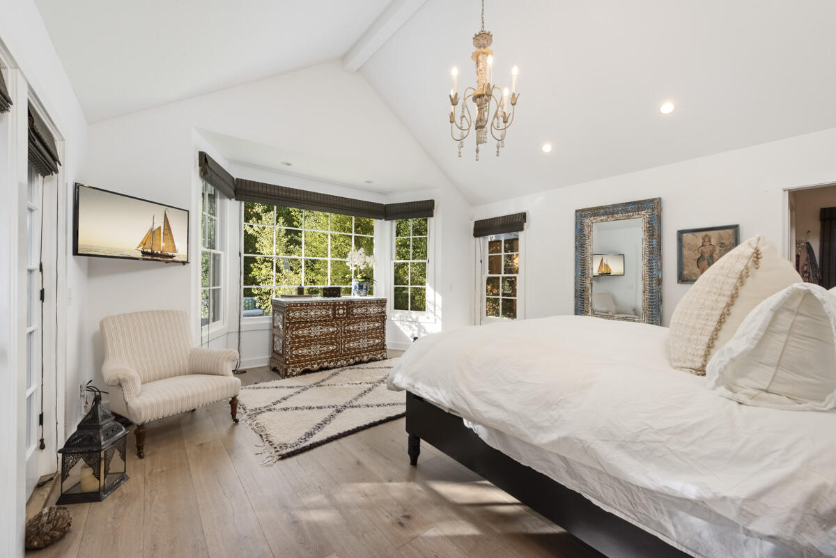 655 Romero Canyon Road Montecito, CA 93108 - Photo 15 of 23 a spacious bedroom with a bed a couch and large window
