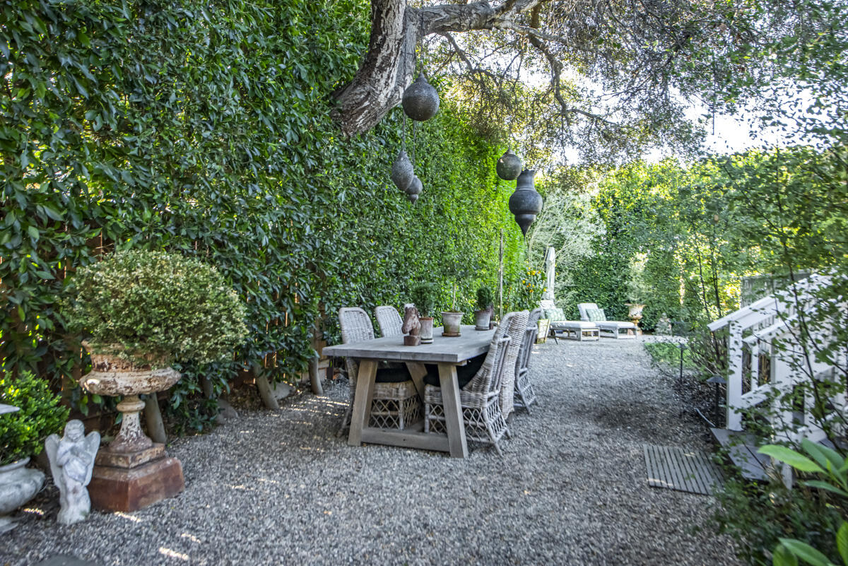 655 Romero Canyon Road Montecito, CA 93108 - Photo 21 of 23 a backyard of a house with table and chairs
