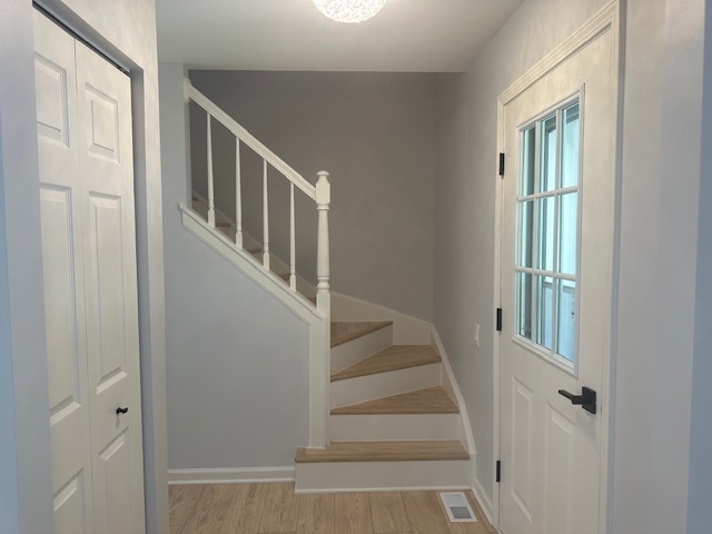 1311 Blue Ridge Parkway Algonquin, IL 60102 - Photo 11 of 21 a view of staircase with lots of frames and door