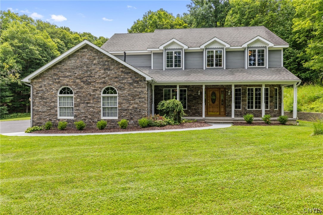 1103 Rail Fence Road Camillus, NY 13031 - Photo 2 of 50 Vinyl siding with stone accents, front porch and 40 year shingles