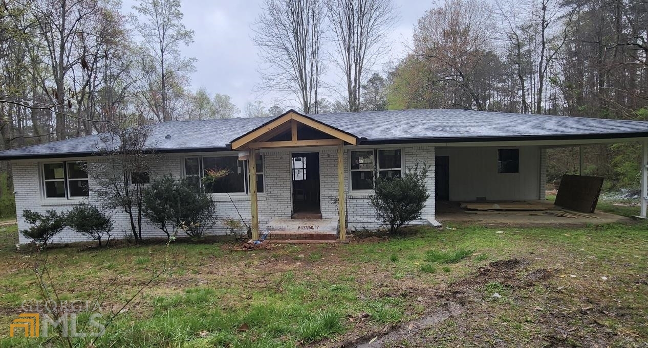 7782 Post Road Winston, GA 30187 - Photo 1 of 1 a front view of a house with garden