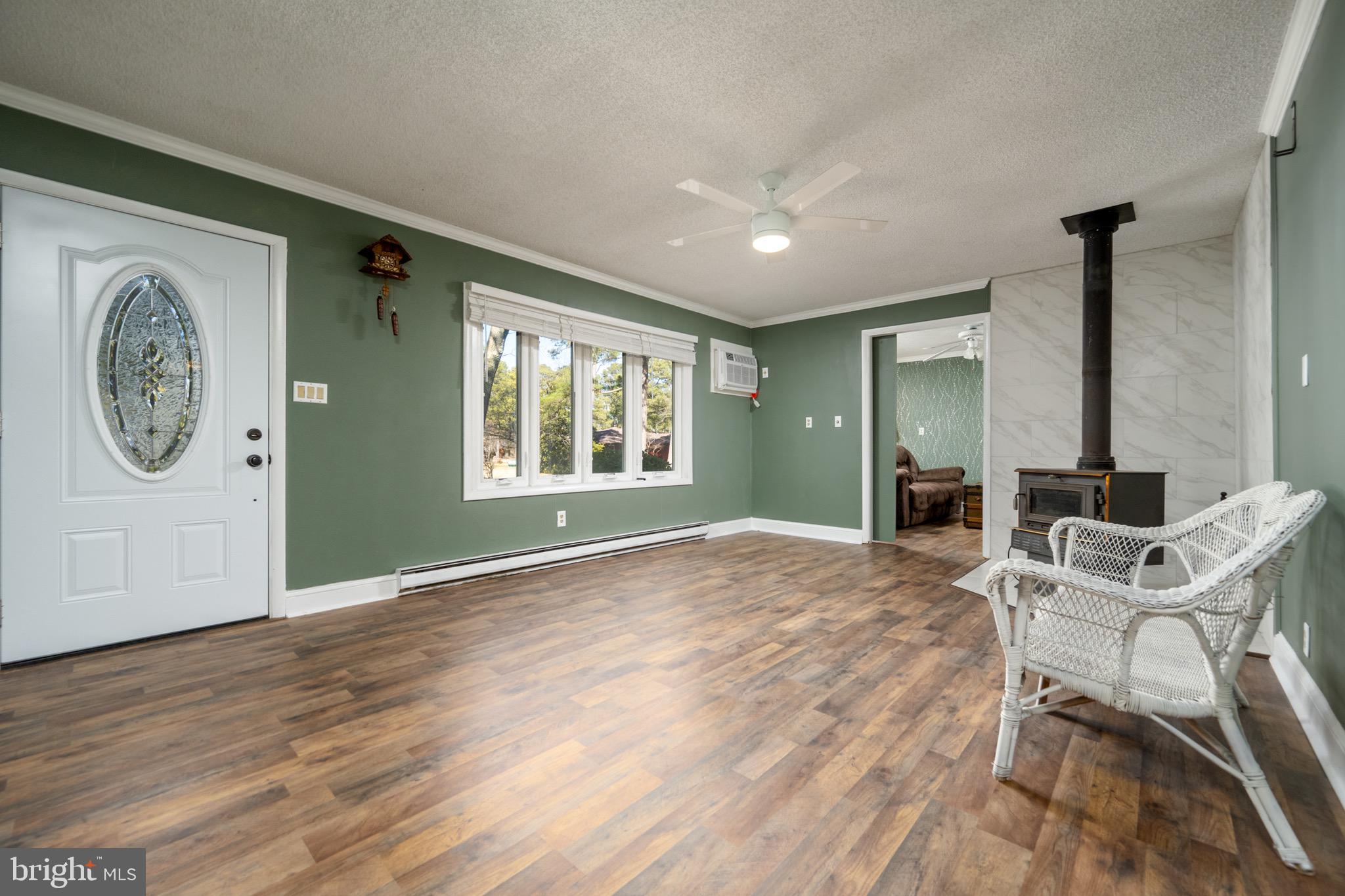 5053 Manokin Road Crisfield, MD 21817 - Photo 10 of 44 Living room with fireplace