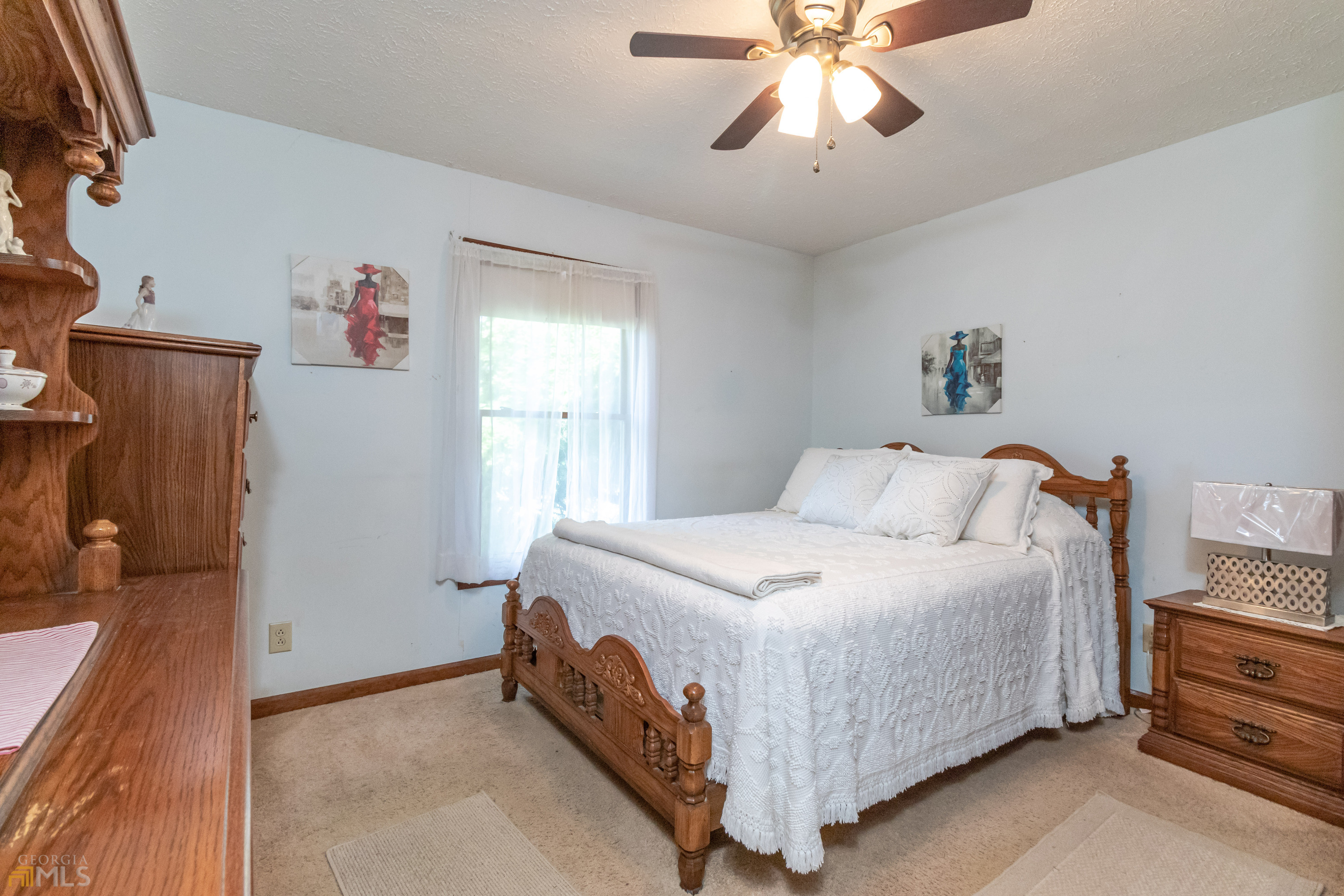 164 Jones Road Molena, GA 30258 - Photo 13 of 25 a bedroom with a bed and a chandelier