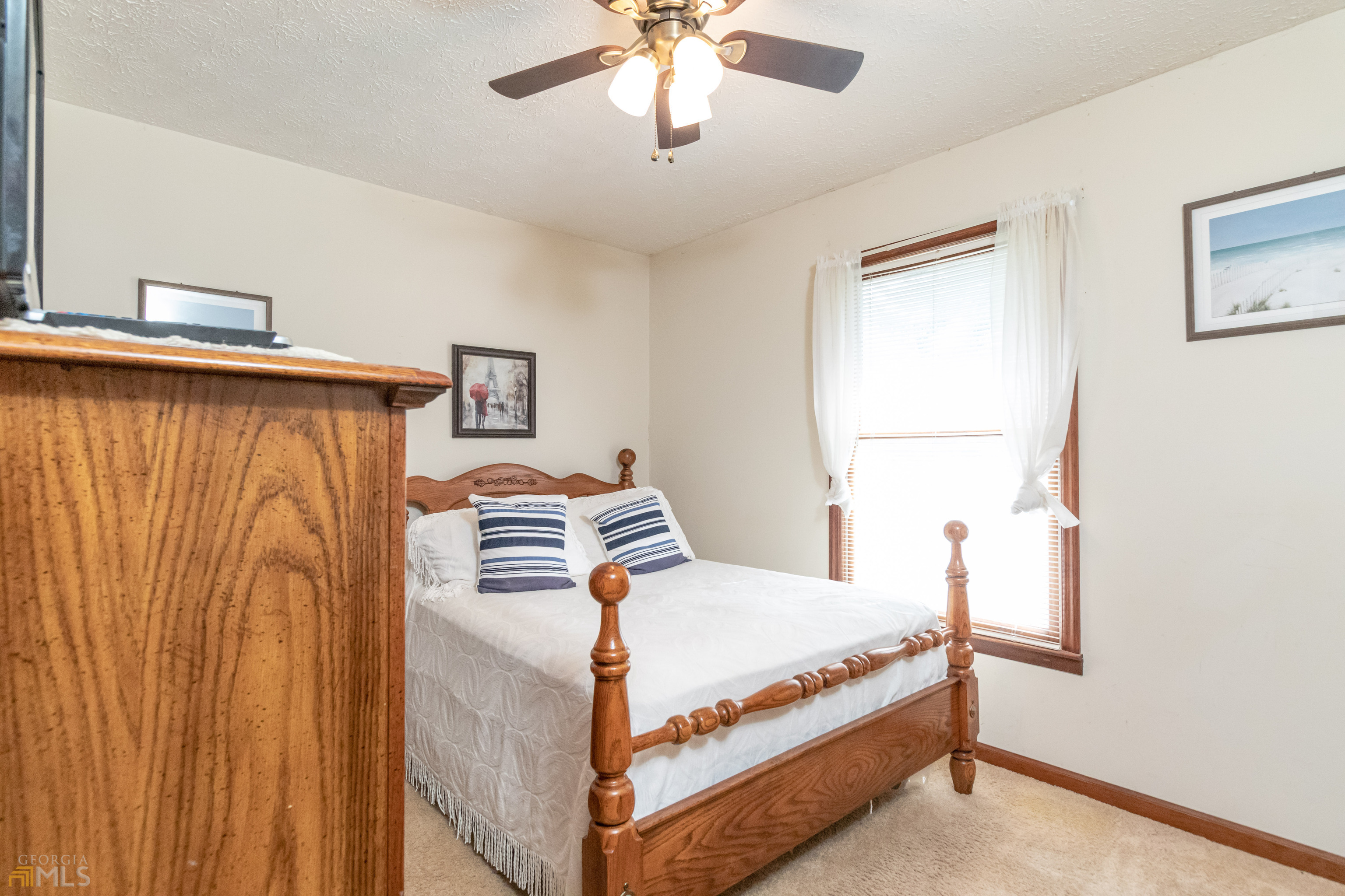 164 Jones Road Molena, GA 30258 - Photo 14 of 25 a bedroom with a bed and a window