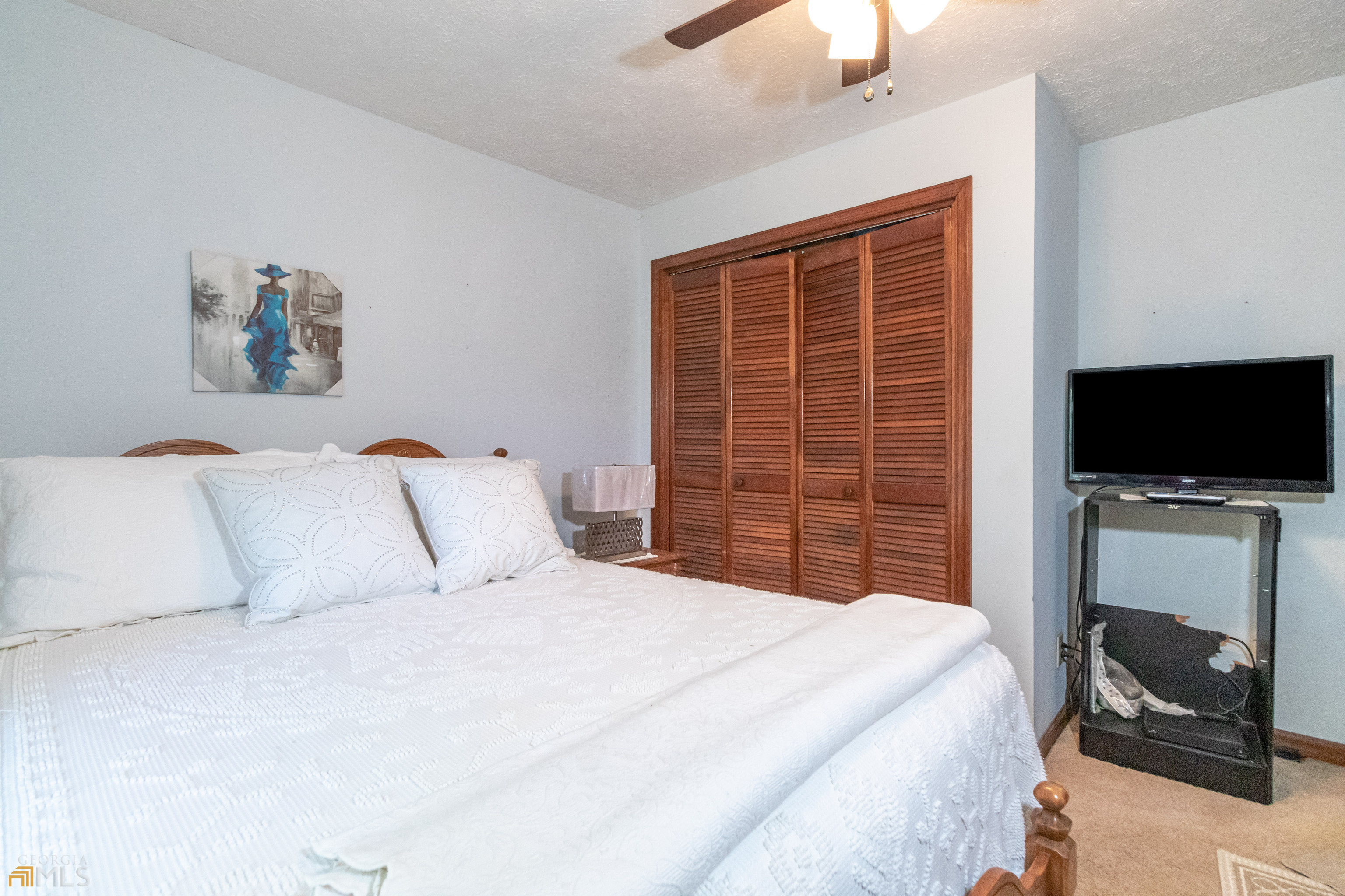 164 Jones Road Molena, GA 30258 - Photo 15 of 25 a bedroom with a bed and a flat screen tv