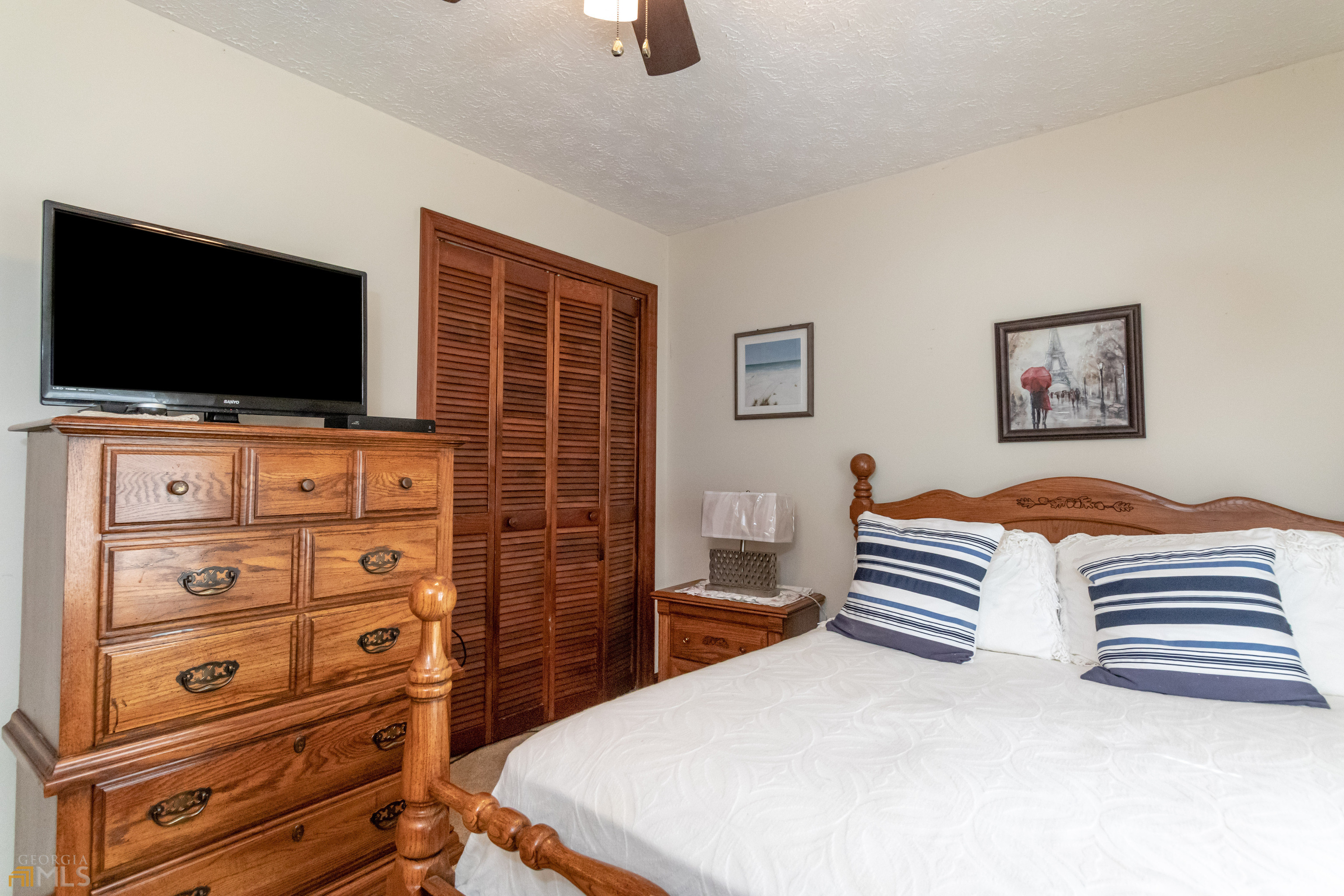 164 Jones Road Molena, GA 30258 - Photo 16 of 25 a bedroom with a bed and a flat screen tv