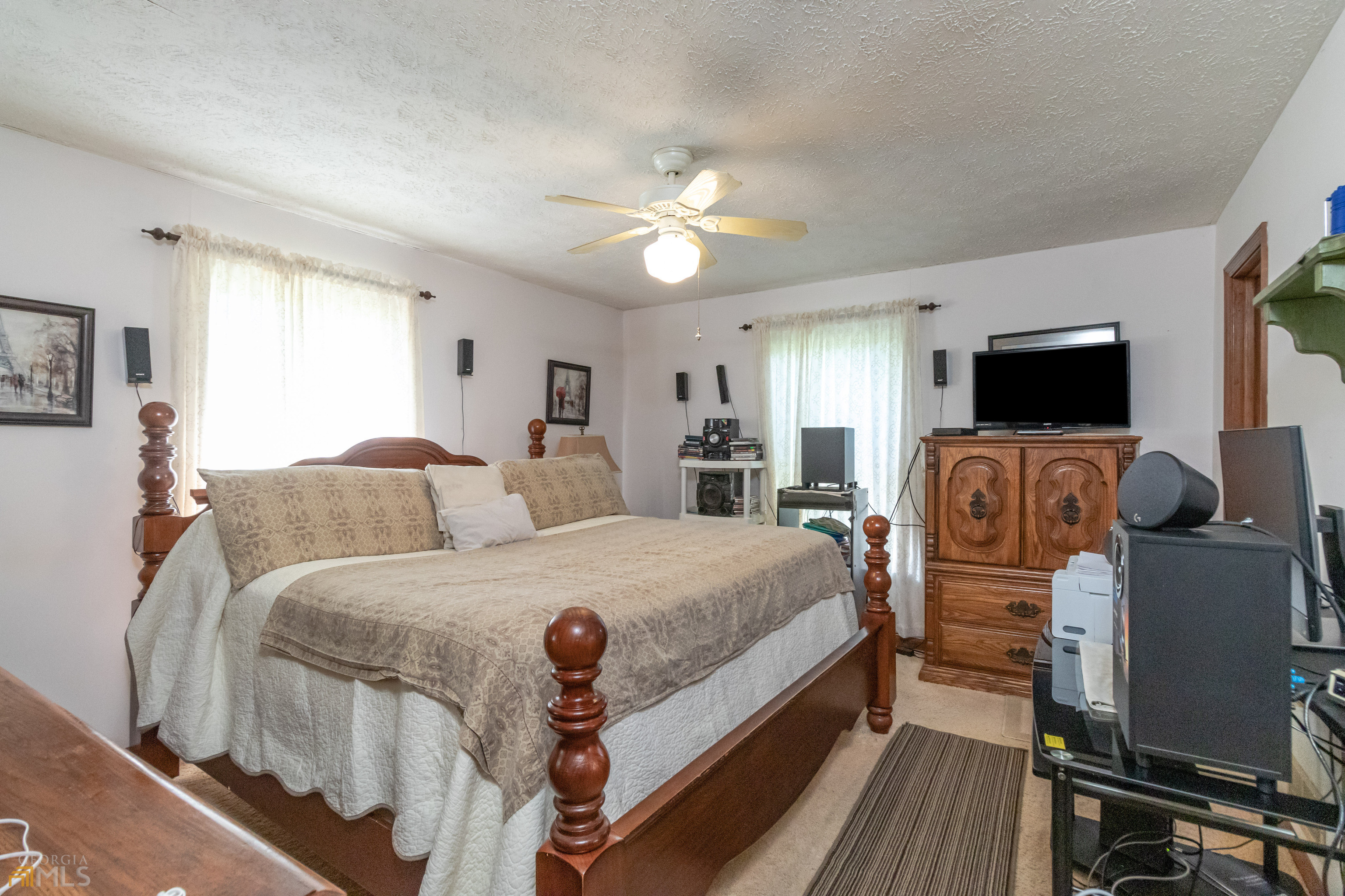 164 Jones Road Molena, GA 30258 - Photo 17 of 25 a bed room with a bed and a television