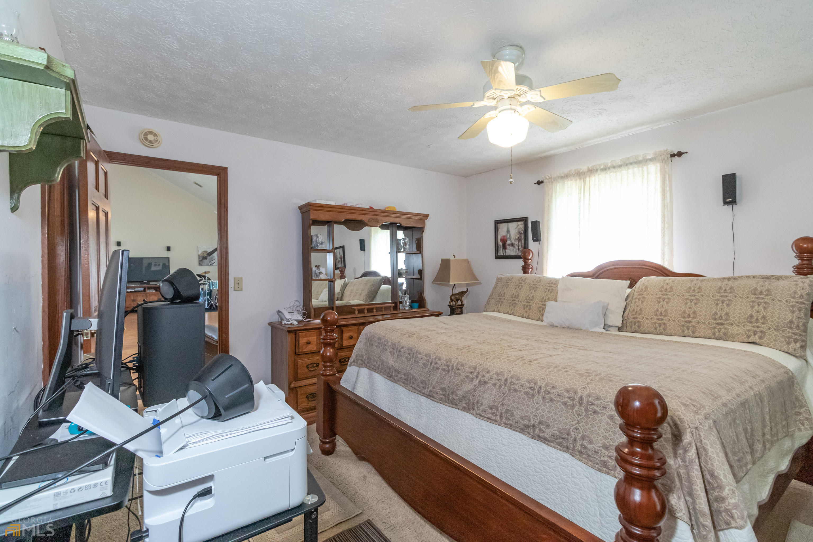 164 Jones Road Molena, GA 30258 - Photo 18 of 25 a bedroom with a bed and a chandelier