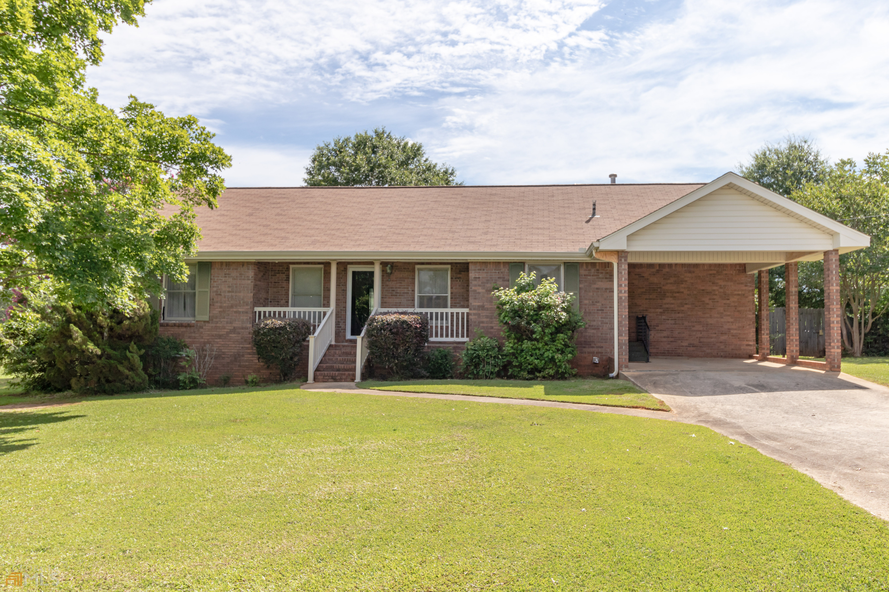 164 Jones Road Molena, GA 30258 - Photo 2 of 25 a front view of a house with yard and green space