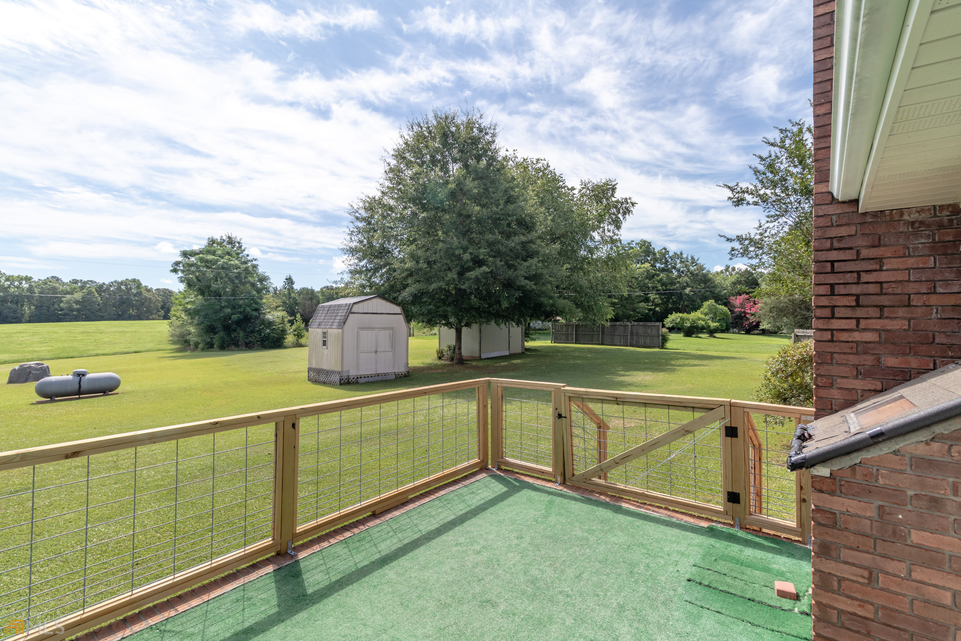 164 Jones Road Molena, GA 30258 - Photo 22 of 25 a view of a lake with a houses in the background
