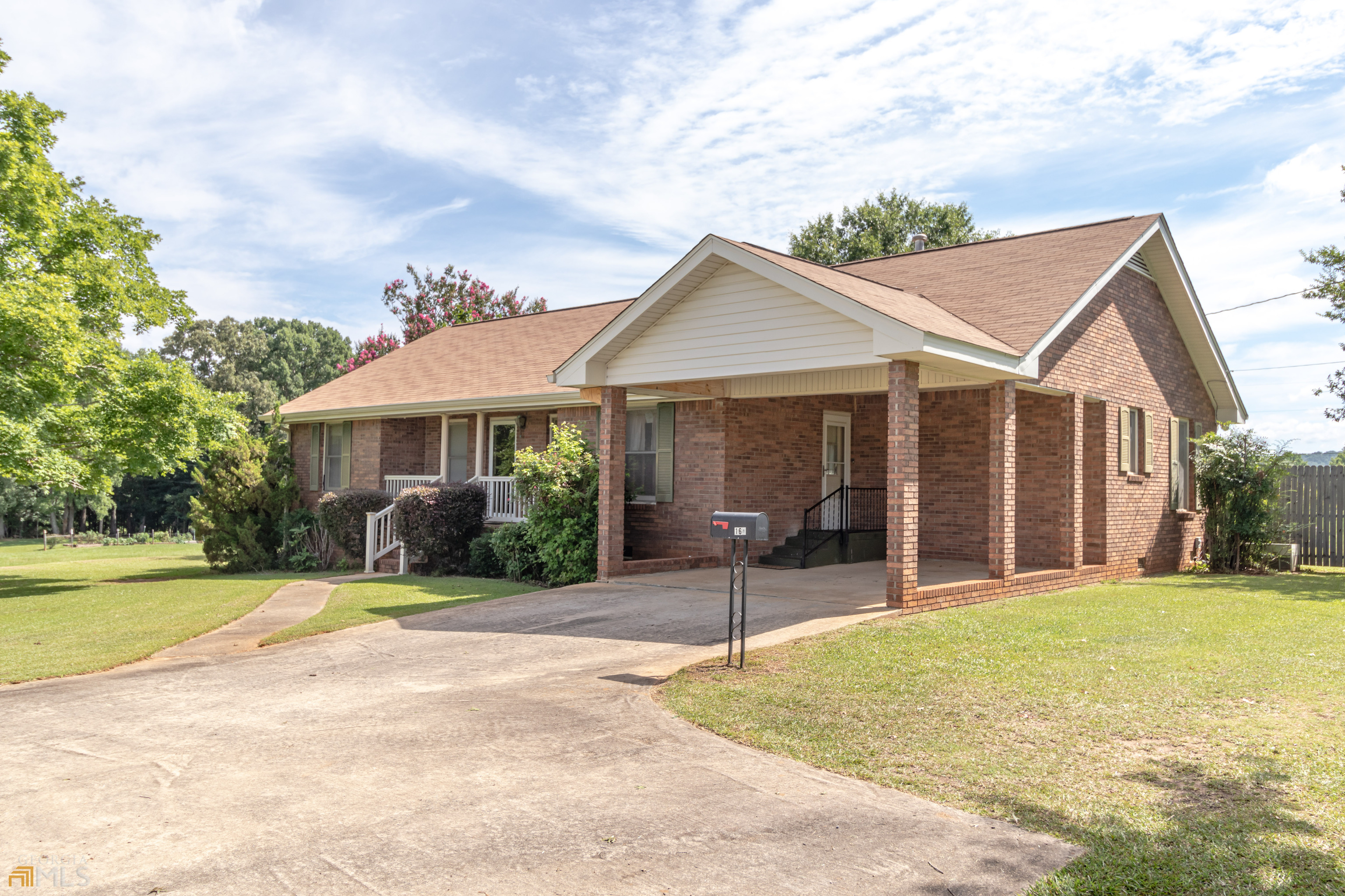 164 Jones Road Molena, GA 30258 - Photo 5 of 25 a front view of a house with a garden and porch
