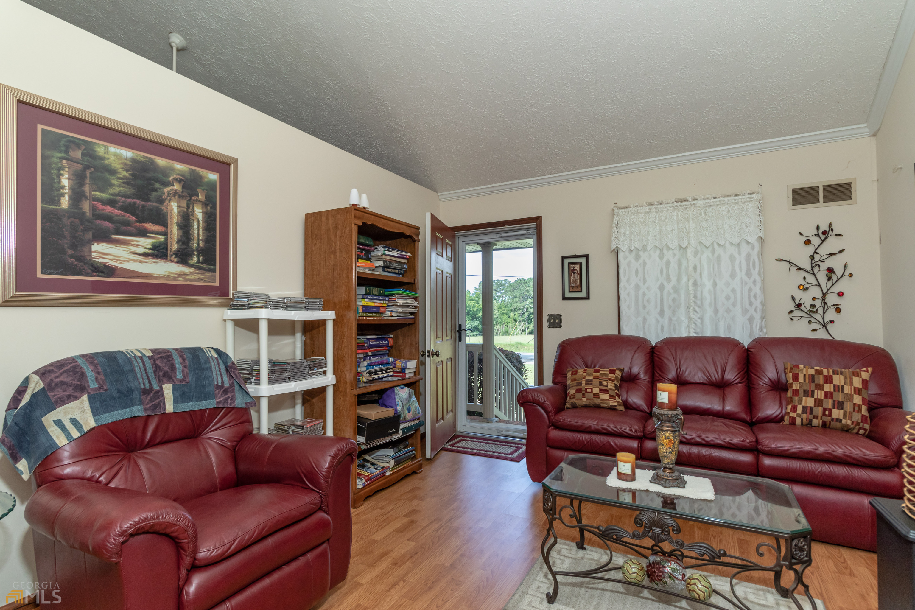 164 Jones Road Molena, GA 30258 - Photo 6 of 25 a living room with furniture and a book shelf