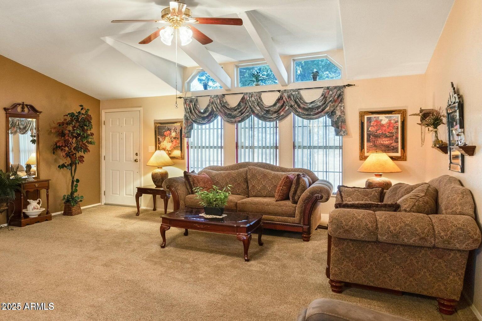 5780 South Mescalero Road Hereford, AZ 85615 - Photo 15 of 45 a living room with furniture and a chandelier