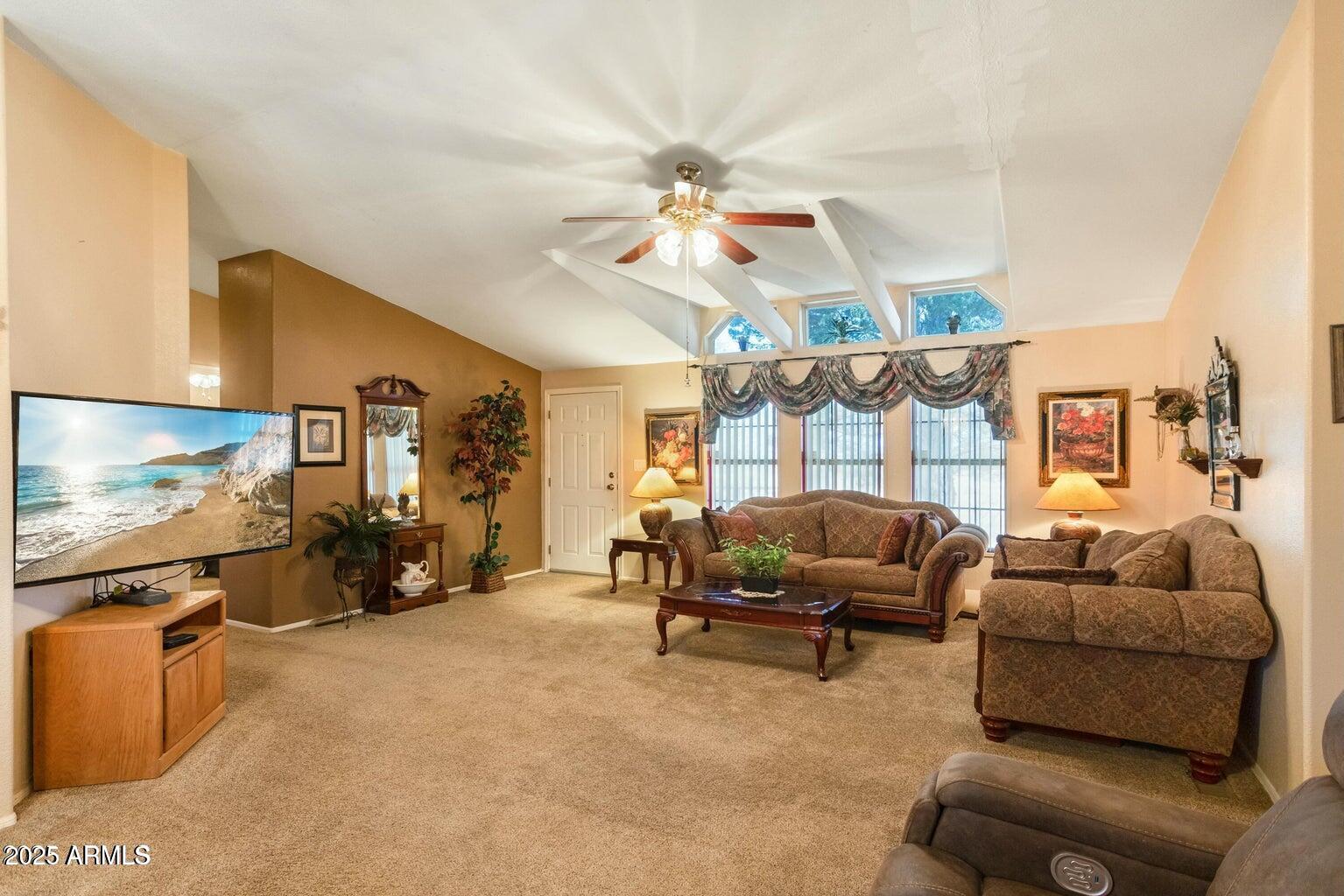 5780 South Mescalero Road Hereford, AZ 85615 - Photo 16 of 45 a living room with furniture and a flat screen tv