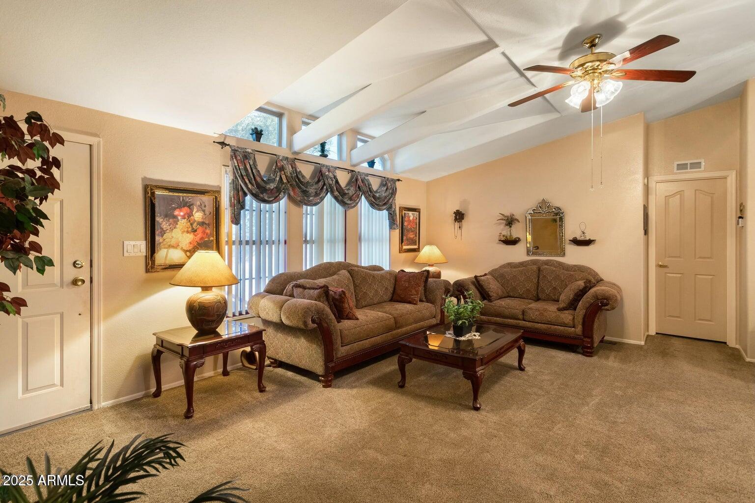 5780 South Mescalero Road Hereford, AZ 85615 - Photo 18 of 45 a living room with furniture and a large window