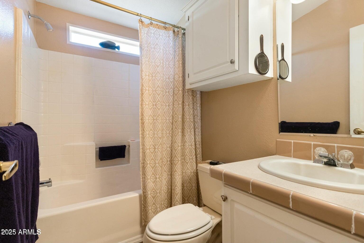 5780 South Mescalero Road Hereford, AZ 85615 - Photo 23 of 45 a bathroom with a sink toilet and shower