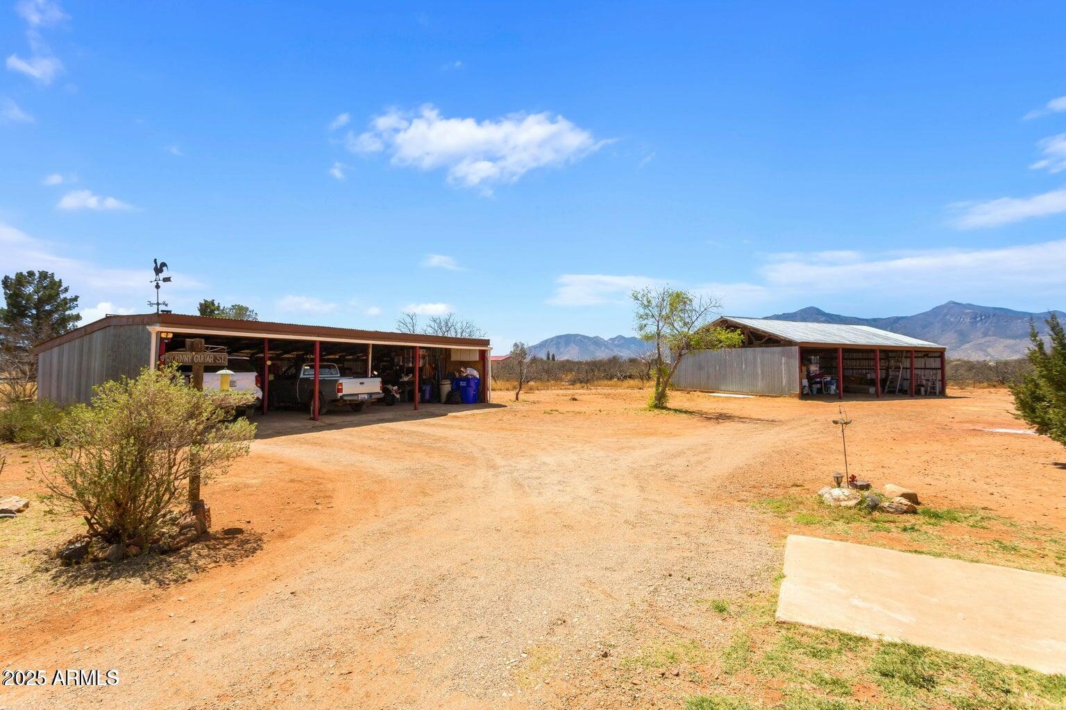 5780 South Mescalero Road Hereford, AZ 85615 - Photo 28 of 45 a front view of a house with a yard