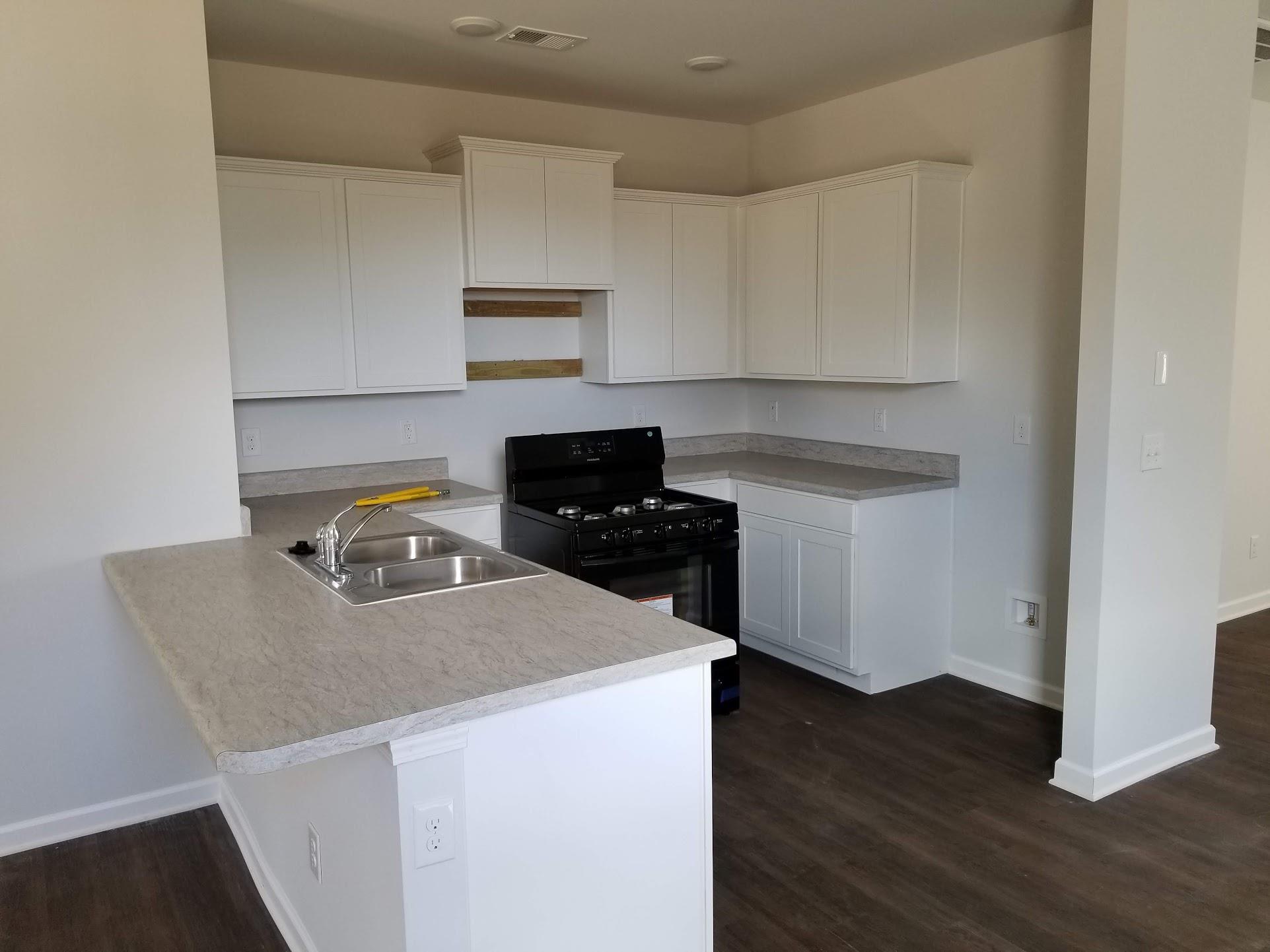9006 Fenton Road Lebanon, TN 37087 - Photo 3 of 20 Kitchen is open to living area and has a pantry.